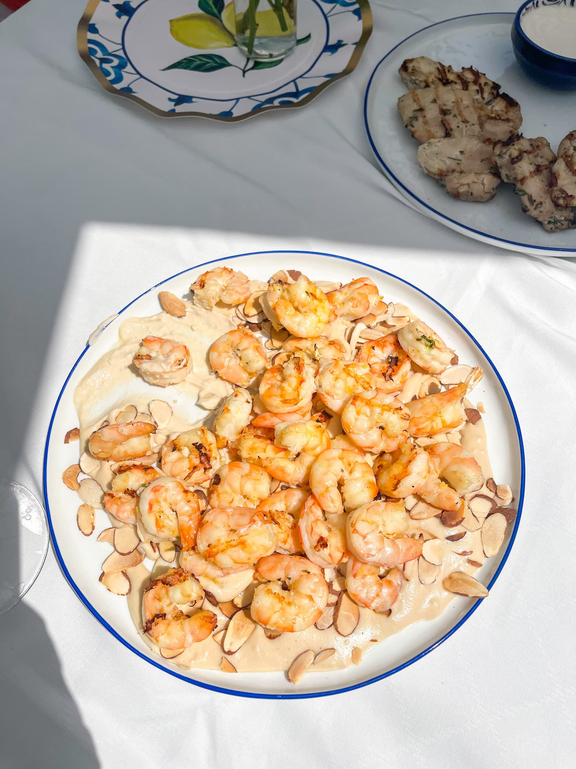 Grilled Gulf shrimp in a blue-rimmed bowl prepared by a private chef in Tampa