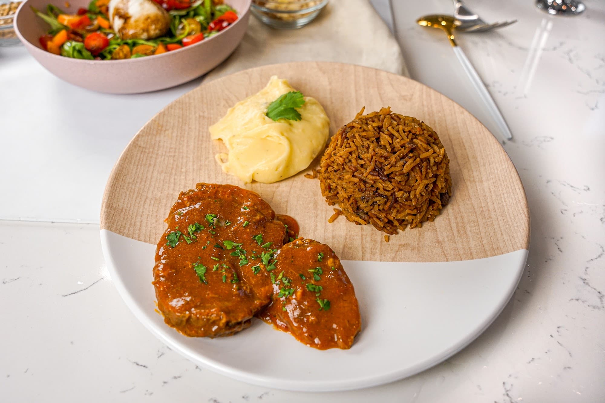 A plated weeknight dinner of steak, mashed potato, and rice from a private chef in Atlanta