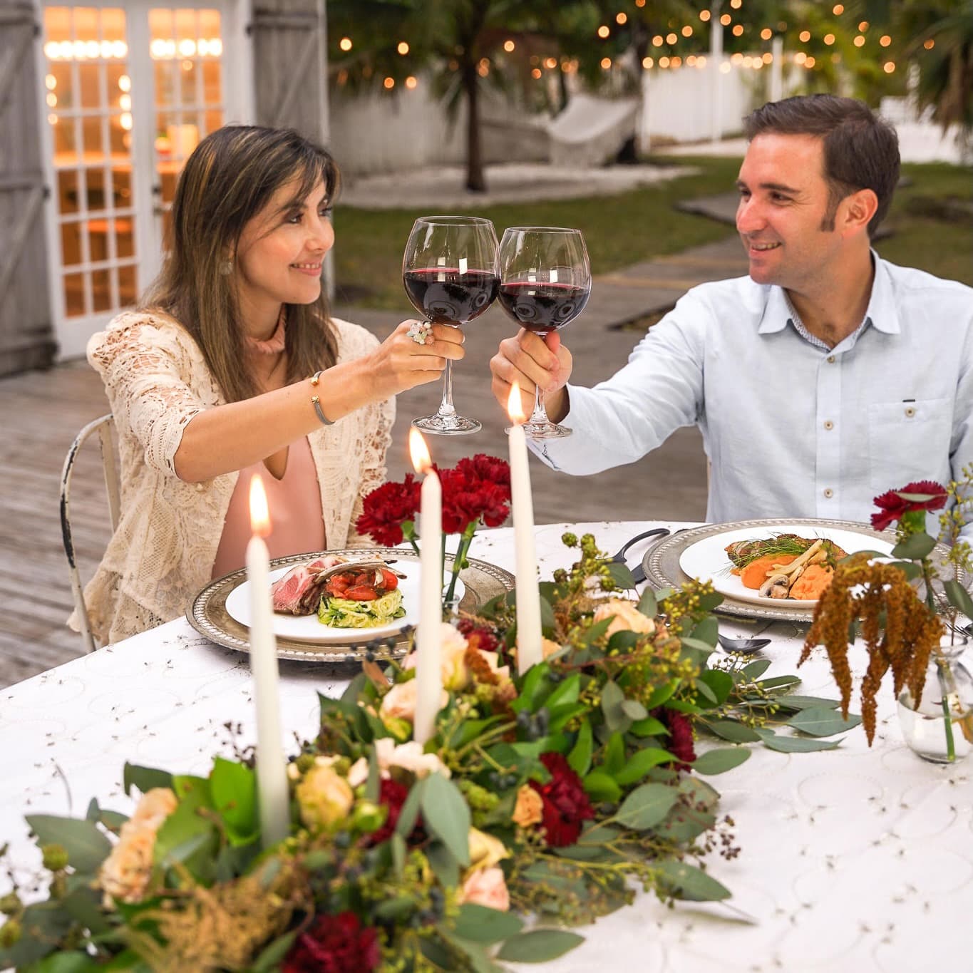 A couple enjoying a private chef date-night dinner in an oceanfront Bal Harbour residence