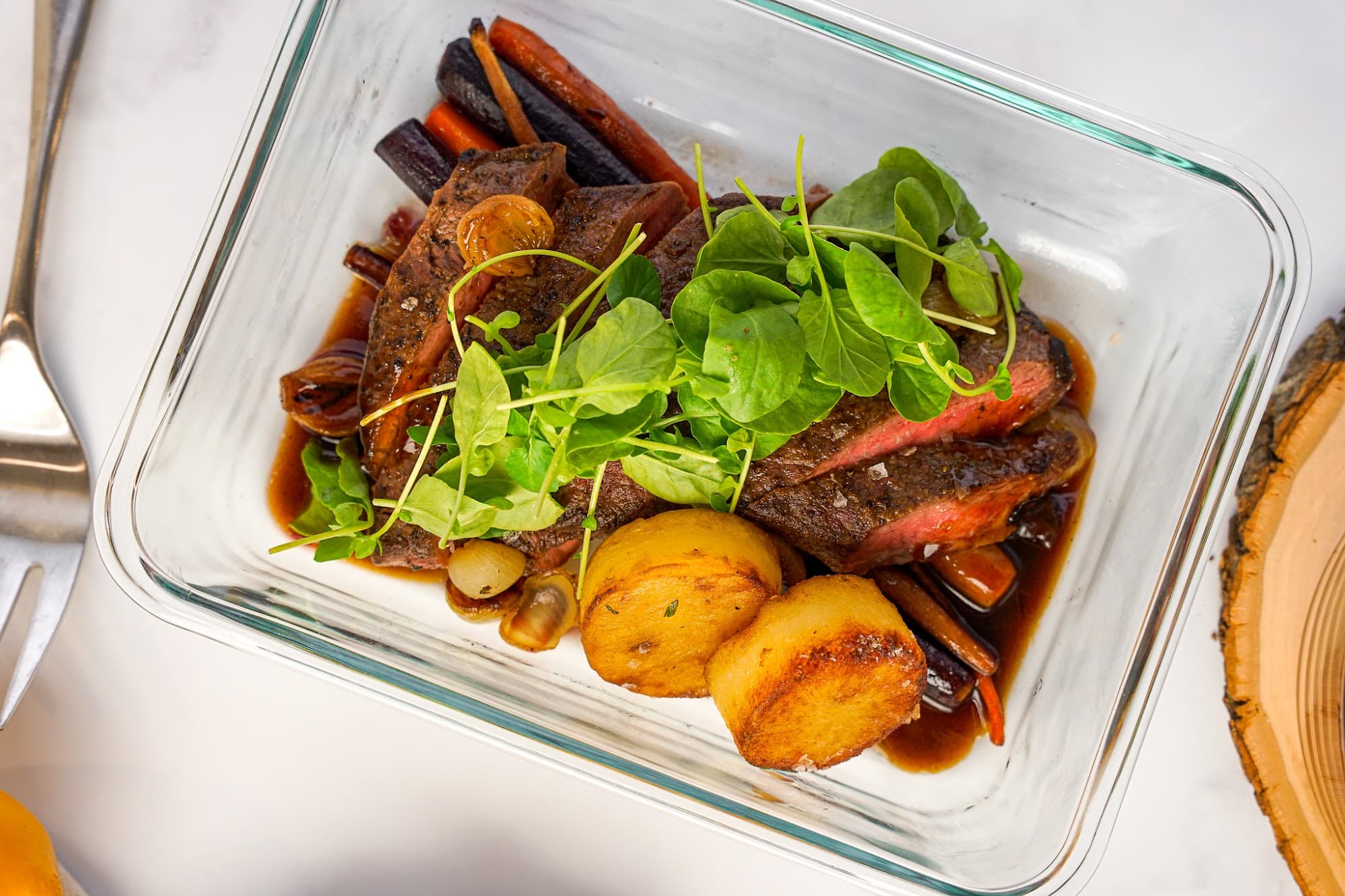 A Chefpost private chef plating a healthy meal-prep dish in a Jersey City kitchen