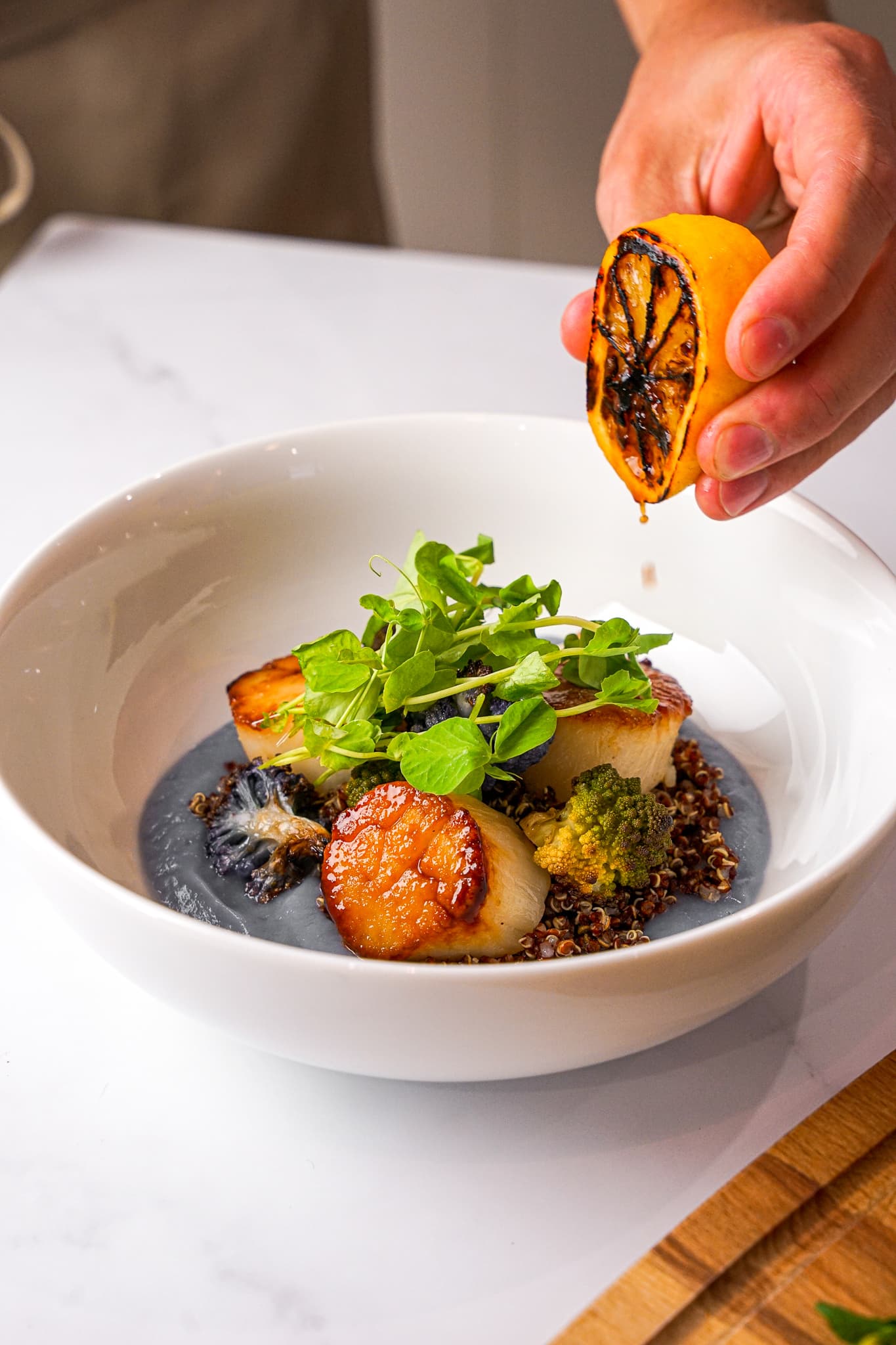 Seared scallops and coastal seafood plated by a private chef in Bal Harbour